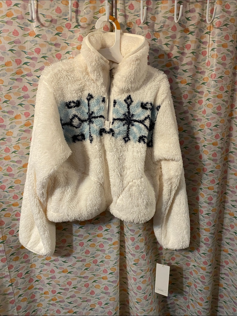 Cozy Cream Sherpa Pullover with Blue & Black Snowflake Pattern